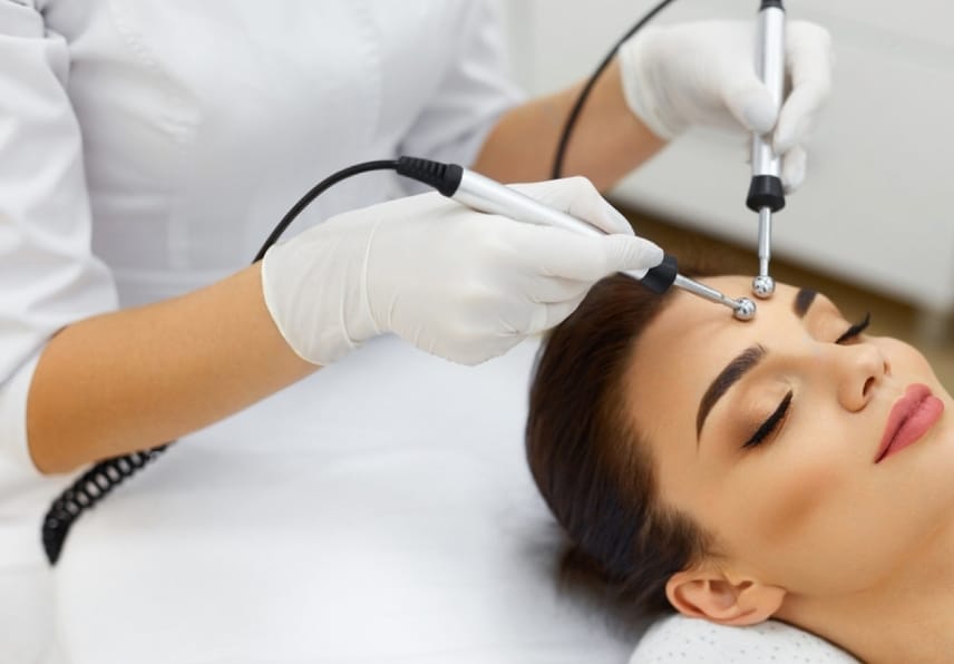 stock photo facial skin closeup of beautiful woman receiving facial microcurrent treatment from therapist at 580636894 transformed 1